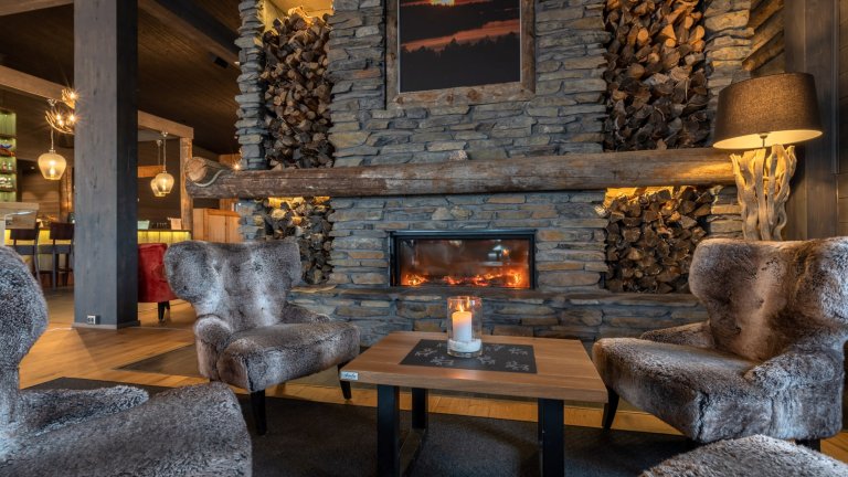 Lobby and fireplace at Wilderness Hotel Inari